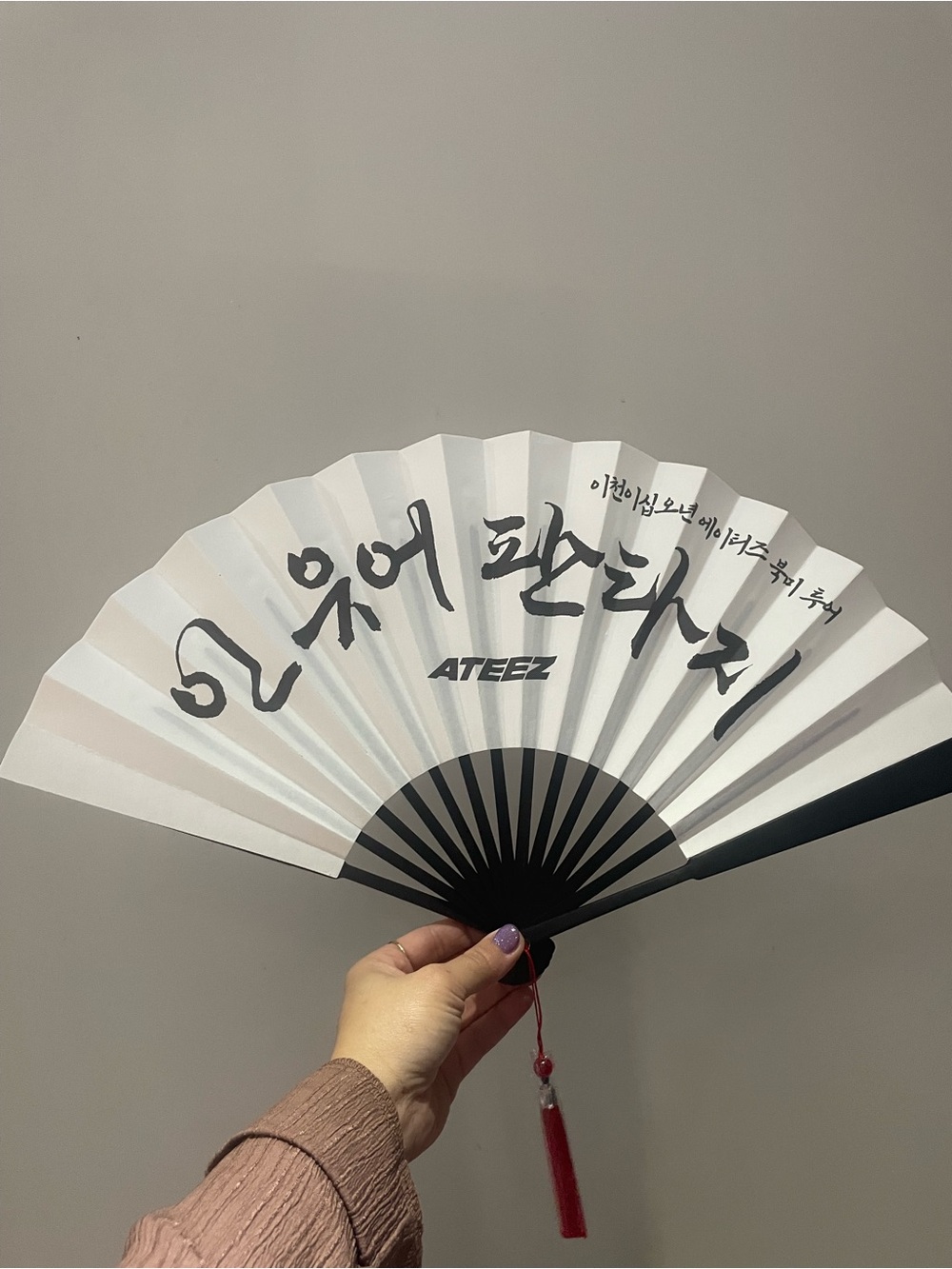 White Folding Hand Fan with Black Accents and Red Tassel